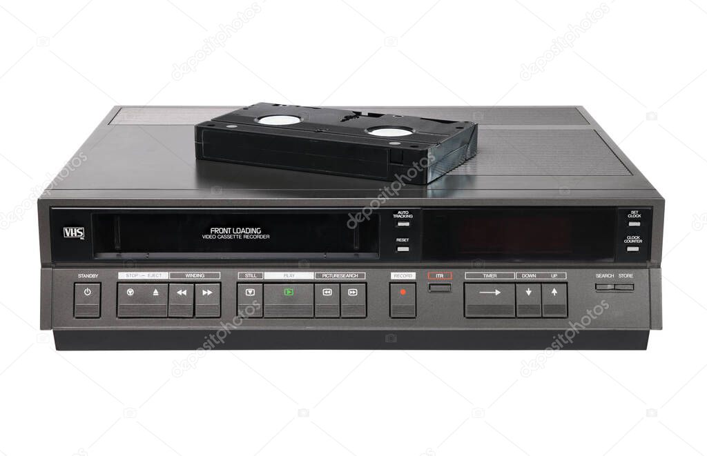 Old videocassette recorder 1980s-1990s with videotape isolated on white background. foreground