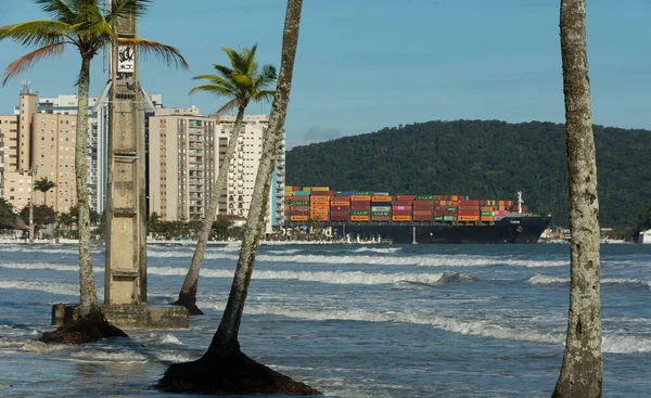 City of Santos, Brazil. June 13, 2022: Hapag Loid container ship passing through the harbor channel on a high tide day. 