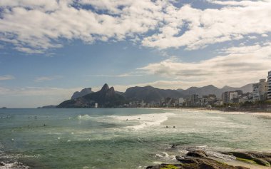 Rio de janeiro Brazil. Aerial view of Leme beach and Atlantica avenue on a sunny morning. A bulk carrier is approaching towards the port.