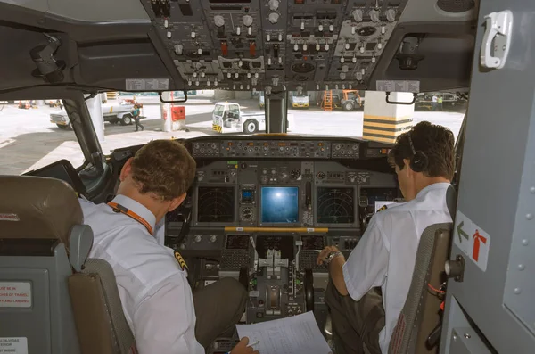 Salvador, Brazil March 16, 2012. Aircraft interior. Flight deck, command cabin, cockpit, control panel. Pilot and co-pilot. Gol Airlines Boeing 737-800.