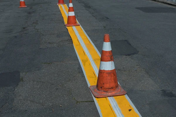 Traffic signage. Asphalt painting. Direction lane divider.