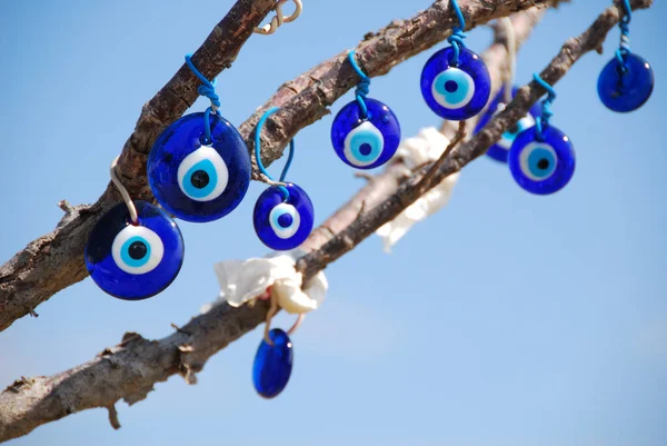 Turkish eyes, stuck in dry branches. Cappadocia, Turkey.