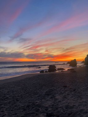 a beautiful view of the sunset over the beach