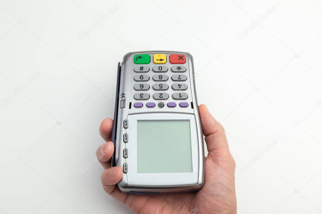 the waiter holds out a mobile Bank terminal