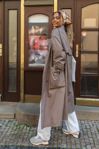 Full Length Cheerful African American Woman Headscarf Trendy Trench Coat — 스톡 사진