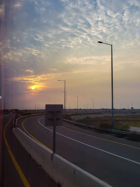 Sun setting on M4 motorway