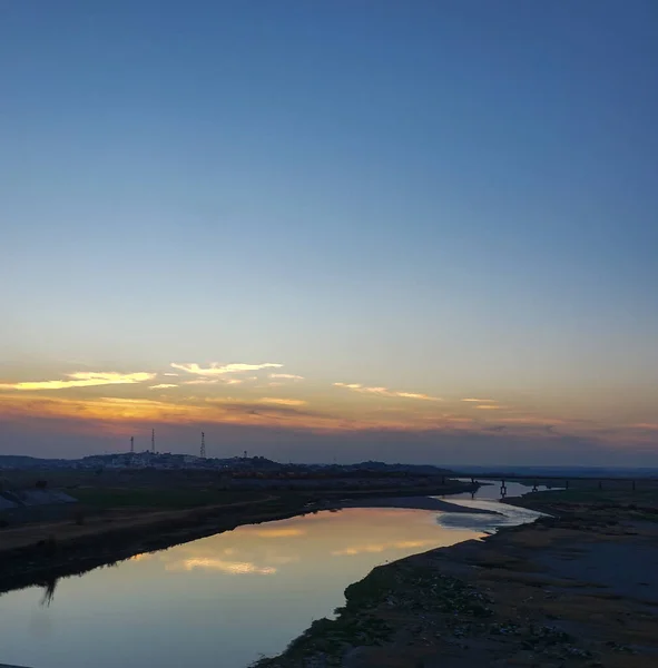 A river coming from an Industrial area