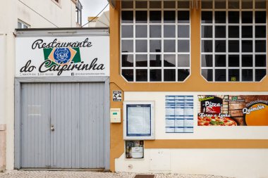 Figueira da Foz, Coimbra, Portugal - October 25, 2020: Facade of the restaurant do Caipirinha (caipirinha restaurant) in the city center on an autumn evening