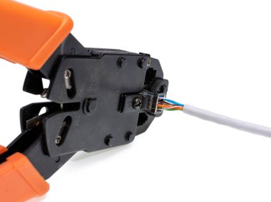 Ethernet cable crimping tool. Twisted pair UTP Cat 5 cable crimp RJ45 connector. Isolated on white background.