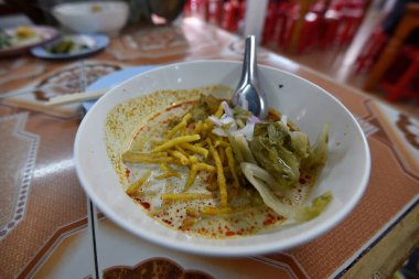 Khao Soi dish in close range on a table