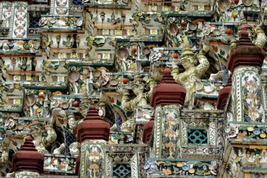 Colorful porcelain and monkey sculpture of Buddhist pagoda, Wat Arun, Thailand 