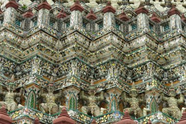 Colorful porcelain and monkey sculpture of Buddhist pagoda, Wat Arun, Thailand 