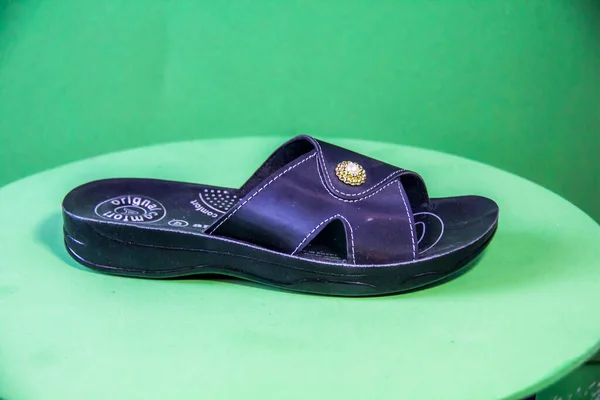 Illustrative Editorial Branded Photography Slipper Shouted Green Background Shot Selective — Photo