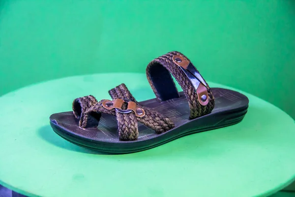 Illustrative Editorial Branded Photography Slipper Shouted Green Background Shot Selective — Stockfoto