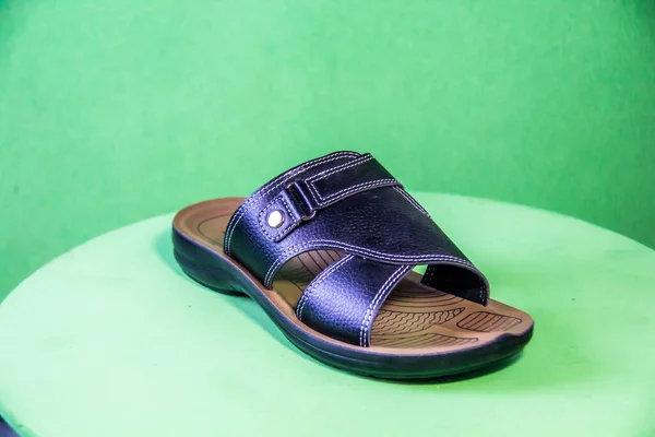 Illustrative Editorial Branded Photography Slipper Shouted Green Background Shot Selective — Stock Fotó