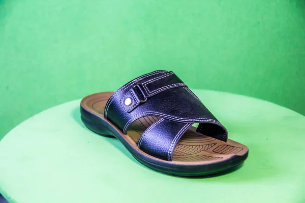 Illustrative Editorial Branded Photography Slipper Shouted Green Background Shot Selective — Stockfoto