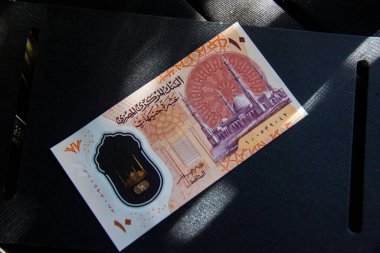 Egyptian polymer banknote, Egyptian 10 pounds, shot is selective focus with shallow depth of field. Taken at Cairo Egypt.
