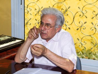 Editorial photo for Maestro Sleem Sahab at his office. Photo is selective focus with shallow depth of field. Photo taken at Cairo Egypt on 11 May 2007