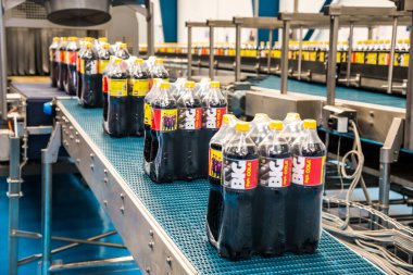 Big Cola factory, manufacture steps, shot is selective focus with shallow depth of field. Photos taken at Cairo Egypt on 21 January 2016