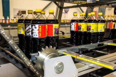 Big Cola factory, manufacture steps, shot is selective focus with shallow depth of field. Photos taken at Cairo Egypt on 21 January 2016
