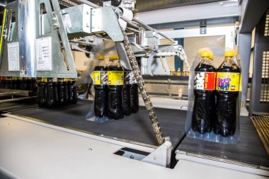 Big Cola factory, manufacture steps, shot is selective focus with shallow depth of field. Photos taken at Cairo Egypt on 21 January 2016