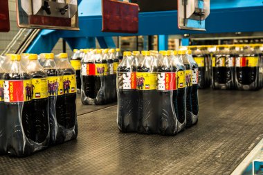 Big Cola factory, manufacture steps, shot is selective focus with shallow depth of field. Photos taken at Cairo Egypt on 21 January 2016