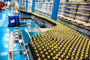 Big Cola factory, manufacture steps, shot is selective focus with shallow depth of field. Photos taken at Cairo Egypt on 21 January 2016