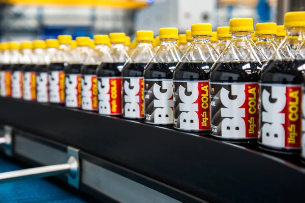 Big Cola factory, manufacture steps, shot is selective focus with shallow depth of field. Photos taken at Cairo Egypt on 21 January 2016