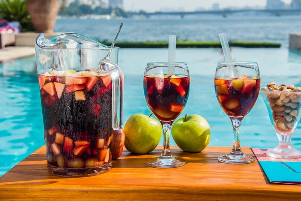 Red Sangria with fruits and nuts on the hotel pool by the nile side, shots taken at an Hotel swimming pool, Cairo Egypt
