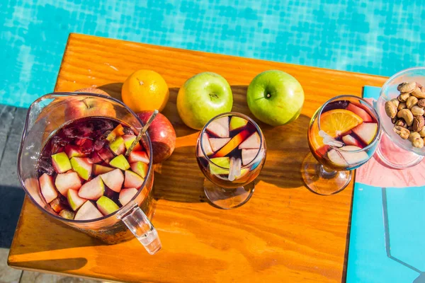 Red Sangria with fruits and nuts on the hotel pool by the nile side, shots taken at an Hotel swimming pool, Cairo Egypt