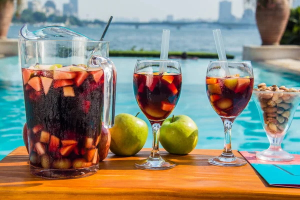 Red Sangria with fruits and nuts on the hotel pool by the nile side, shots taken at an Hotel swimming pool, Cairo Egypt