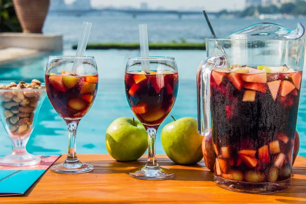 Red Sangria with fruits and nuts on the hotel pool by the nile side, shots taken at an Hotel swimming pool, Cairo Egypt