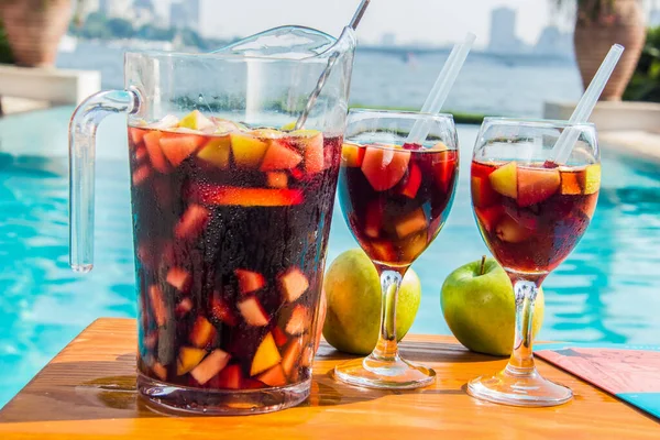 Red Sangria with fruits and nuts on the hotel pool by the nile side, shots taken at an Hotel swimming pool, Cairo Egypt