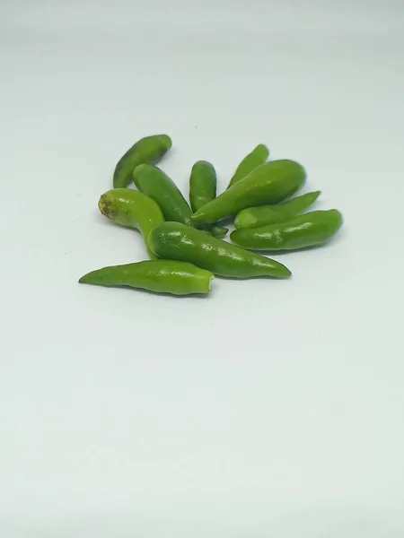 Fresh green cayenne pepper on a white background. food concept
