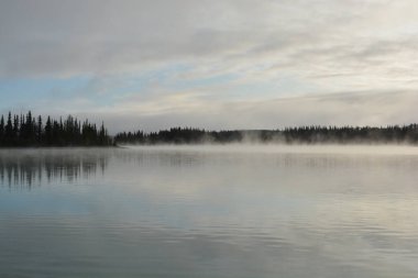 mist rising from beautiful boya lake northern bc