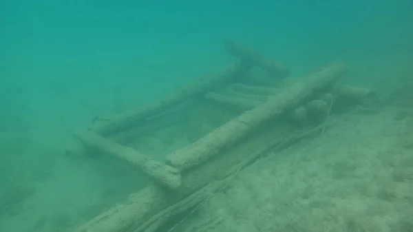 cabin or dock wreck under water fresh water dive