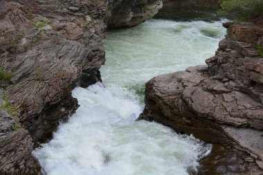 river going through narrow spot. 11 mile creek in northern bc
