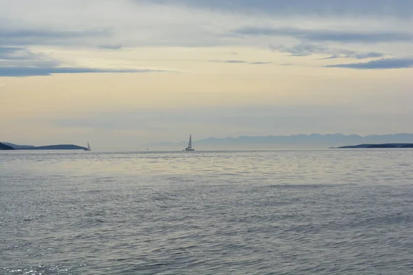 beautiful view of nature scene with a sailboat