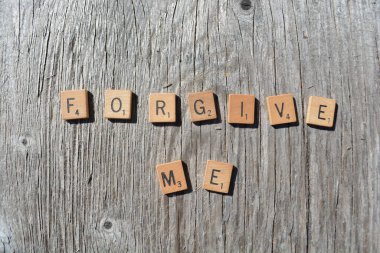 Motivational scrabble word art on old wood backing