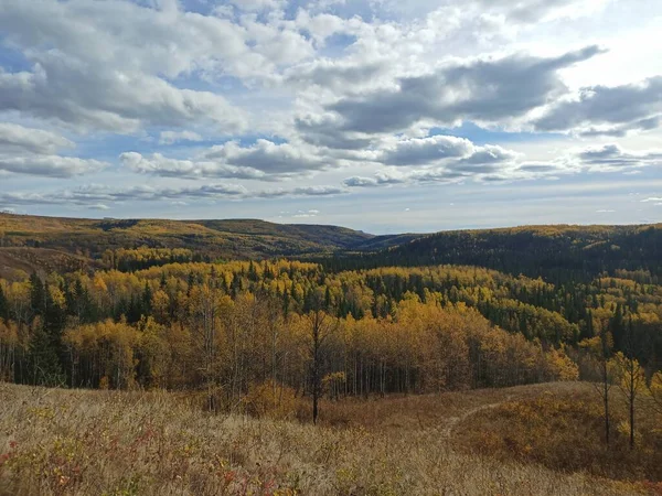 beautiful autumn scene with hills and fall colors northern bc