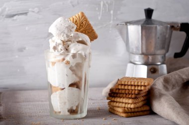 icecream and biscuits on wooden background. rustic style