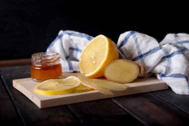 lemon, ginger, honey on wooden table