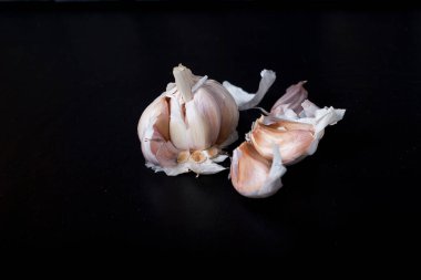 garlic on black background. selective focus