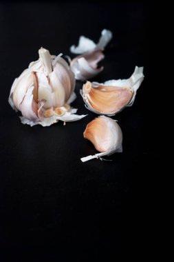 garlic on black background. selective focus