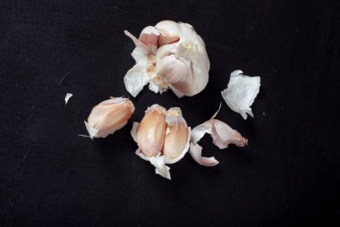 garlic on black background. selective focus