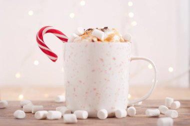 coffee with whipped cream, marshmallow and coffee beans