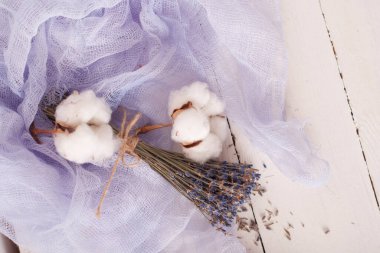 lavender and cotton with violet textile on white wooden table. 