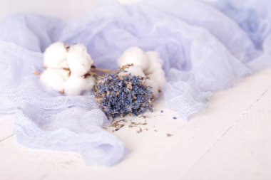 lavender and cotton with violet textile on white wooden table. 