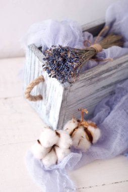 lavender and cotton with violet textile on white wooden table. 