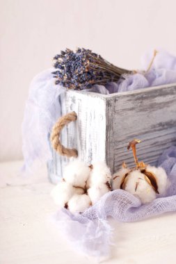 lavender and cotton with violet textile on white wooden table. 